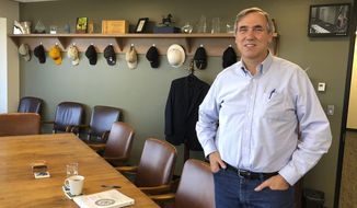 FILE - In this Sept. 7, 2018 file photo Sen Jeff Merkley, D-Ore., poses for a photo in his office in Portland, Ore. Merkley faces Republican Jo Rae Perkins in Tuesday&#39;s election. (AP Photo/Andrew Selskey,File)