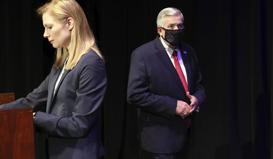 FILE - In this Oct. 9, 2020, file photo, Missouri gubernatorial candidates, Gov. Mike Parson, and State Auditor Nicole Galloway are seen onstage before the Missouri gubernatorial debate at the Missouri Theatre in Columbia, Missouri. They are opposing each other in the Nov. 3, 2020, general election. (Robert Cohen/St. Louis Post-Dispatch via AP, Pool, File)