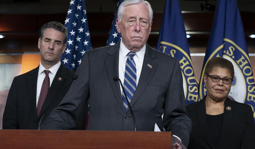 In this Monday, March 9, 2020 file photo, House Majority Leader Steny Hoyer, D-Md., center, speaks during a news conference on Capitol Hill in Washington. (AP Photo/J. Scott Applewhite, File)  **FILE**