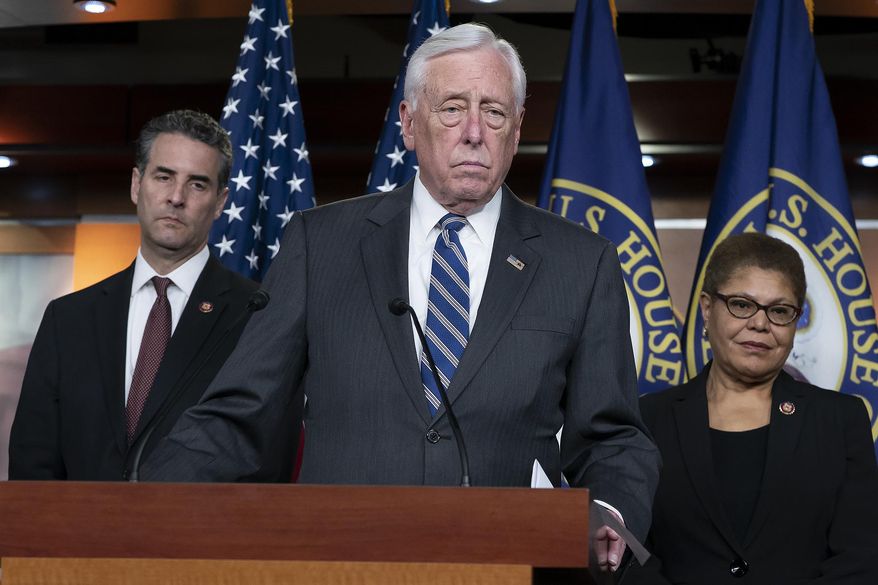 In this Monday, March 9, 2020 file photo, House Majority Leader Steny Hoyer, D-Md., center, speaks during a news conference on Capitol Hill in Washington. (AP Photo/J. Scott Applewhite, File)  **FILE**