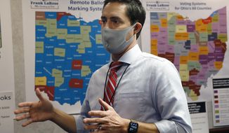 Ohio Secretary of State Frank LaRose interacts with staff members as they follow the election from Ohio&#39;s election command center Tuesday, Nov. 3, 2020, in Columbus, Ohio. (AP Photo/Jay LaPrete)