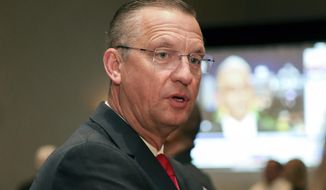 Republican candidate for Senate Rep. Doug Collins attends an election night watch party in Buford, Ga., Tuesday, Nov. 3, 2020. (AP Photo/Brett Davis)