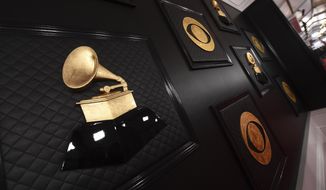 FILE - The red carpet appears prior to the start of the 62nd annual Grammy Awards in Los Angeles on Jan. 26, 2020. The Grammys are changing the name of its best world music album category to the best global music album, an attempt to find “a more relevant, modern and inclusive term.” The Recording Academy said the new name “symbolizes a departure from the connotations of colonialism.” The step comes some five months after the Academy made changes to several Grammy Awards categories, including renaming the best urban contemporary album category as best progressive R&amp;amp;B album.  (Photo by Jordan Strauss/Invision/AP, File)