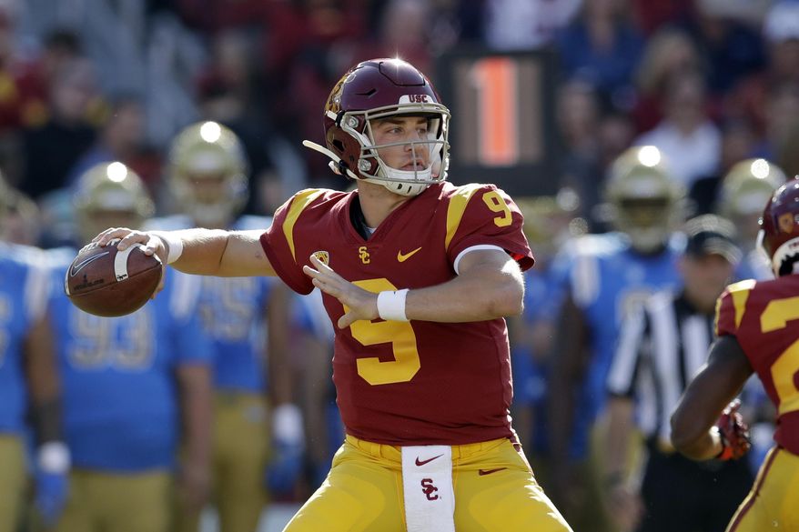 FILE - In this Nov. 23, 2019, file photo, Southern California quarterback Kedon Slovis throws against UCLA during the first half of an NCAA college football game in Los Angeles. Last season's surprise starting quarterback could be one of the nation's best passers this fall, even if he won't catch anybody off guard this weekend when the No. 20 Trojans finally begin their regular season.(AP Photo/Marcio Jose Sanchez, File)