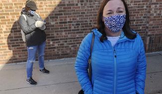 On Friday, Oct. 30, 2020, Stacy Carlson of Hilliard in suburban Columbus, Ohio, said in no uncertain terms that the only issue important to her is voting out President Donald Trump. &amp;quot;The division of the country, his handling of COVID, his handling of civil liberties. The list goes on,&amp;quot; said Carlson while waiting in a line of hundreds of early voters. (AP Photo/Andrew Welsh-Huggins)