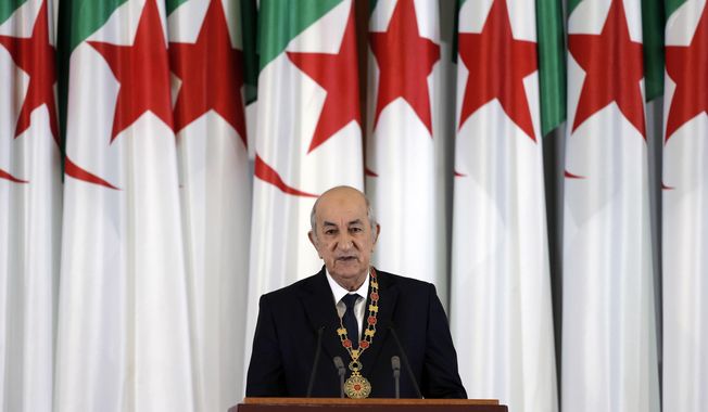 FILE - In this Thursday, Dec. 19, 2019 file photo, Algerian president Abdelmadjid Tebboune delivers a speech during an inauguration ceremony in the presidential palace, in Algiers, Algeria. Tebboune has been transferred to Germany for specialist medical treatment a day after his country’s presidency announced he had been hospitalized but not revealed why. Several senior officials in the 75-year-old president’s entourage developed COVID-19 symptoms on Saturday, Oct. 24, 2020 and the president was placed in what the government called “voluntary preventive confinement.” (AP Photo/Toufik Doudou, FILE)