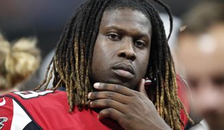FILE - In this Aug. 17, 2018, file photo, Atlanta Falcons defensive end Takk McKinley (98) sits on the bench during the second half of an NFL preseason football game against the Kansas City Chiefs, in Atlanta. Defensive end Takk McKinley may have jeopardized his future with the Falcons by using social media to complain about not being traded. (AP Photo/John Bazemore, File)