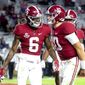 Alabama wide receiver DeVonta Smith (6) and quarterback Mac Jones (10) celebrate a touchdown pass during the second half of an NCAA college football game against Mississippi State on Saturday, Oct. 31, 2020, in Tuscaloosa, Ala. (Gary Cosby Jr./The Tuscaloosa News via AP)