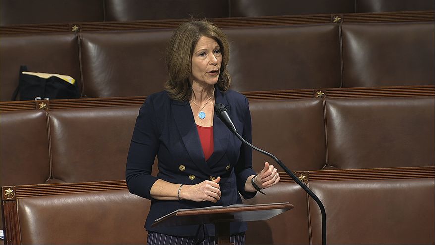 Rep. Cheri Bustos, D-Ill., speaks on the floor of the House of Representatives at the U.S. Capitol in Washington. (House Television via AP, File)