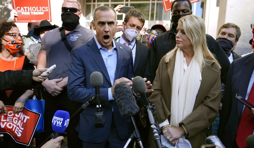President Donald Trump&#39;s campaign adviser Corey Lewandowski, center, speaks about a court order obtained to grant more access to vote counting operations at the Pennsylvania Convention Center, Thursday, Nov. 5, 2020, in Philadelphia, following Tuesday&#39;s election. At right is former Florida Attorney General Pam Bondi. (AP Photo/Matt Slocum)  **FILE**