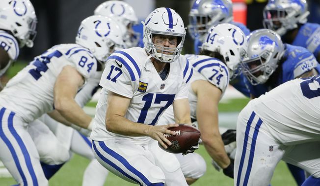 Indianapolis Colts quarterback Philip Rivers prepares to hand off during the second half of an NFL football game against the Detroit Lions, Sunday, Nov. 1, 2020, in Detroit. (AP Photo/Duane Burleson)