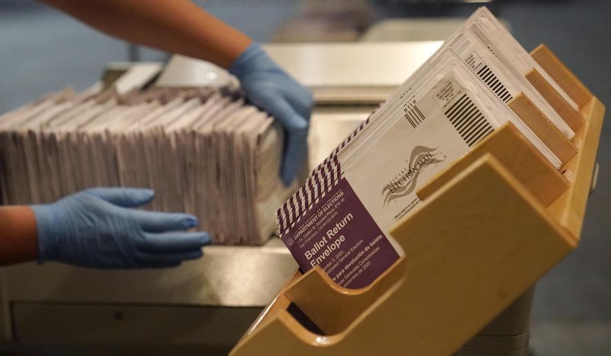 In this Nov. 1, 2020, photo, envelopes containing ballots are shown at a San Francisco Department of Elections at a voting center in San Francisco. (AP Photo/Jeff Chiu) **FILE**