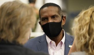Burgess Owens, Republican candidate in Utah&#39;s 4th Congressional District, speaks with people during an Utah Republican election night party Tuesday, Nov. 3, 2020, in Sandy, Utah. (AP Photo/Rick Bowmer)