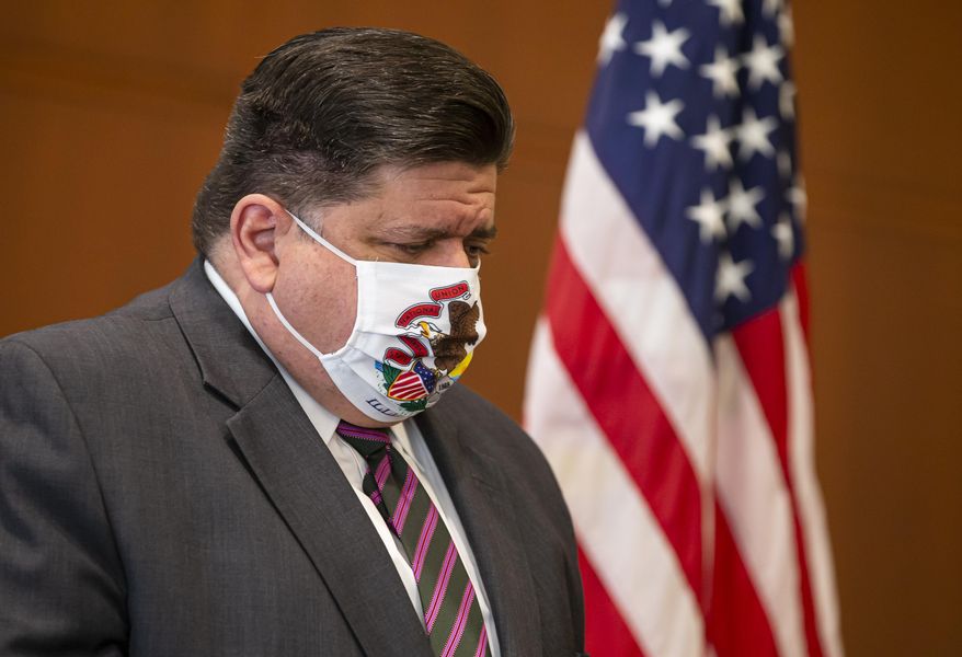 FILE - In this Sept. 21, 2020 file photo, Illinois Governor JB Pritzker appears at a news conference in Springfield, Ill. Voters have rejected a proposal to abolish Illinois' flat-rate income tax for one that would take a greater share from wealthier taxpayers. The outcome of Tuesday's Nov. 3, vote handed Pritzker the first major defeat of his 22-month tenure. (Justin L. Fowler/The State Journal-Register via AP File)