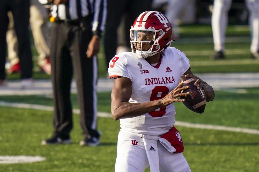 Indiana quarterback Michael Penix Jr. looks for a receiver during the second quarter of the team's NCAA college football game against Rutgers, Saturday, Oct. 31, 2020, in Piscataway, N.J. (AP Photo/Corey Sipkin)
