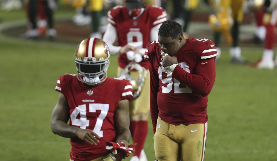 San Francisco 49ers cornerback Jamar Taylor (47) and defensive end Kerry Hyder Jr. (92) walk off the field after ther 49ers lost to the Green Bay Packers in an NFL football game in Santa Clara, Calif., Thursday, Nov. 5, 2020. (AP Photo/Jed Jacobsohn)