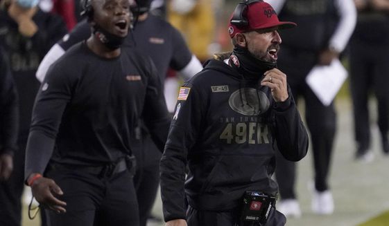 San Francisco 49ers head coach Kyle Shanahan, right, yells during the first half of an NFL football game between the 49ers and the Green Bay Packers in Santa Clara, Calif., Thursday, Nov. 5, 2020. (AP Photo/Tony Avelar)