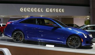 FILE- This Jan. 16, 2019, photo shows a Cadillac ATS V in Detroit. General Motors posted stronger-than-expected earnings in the third quarter, pulling in $4 billion in profit just one quarter after losing money due to the virus outbreak. GM said, Thursday, Nov. 5, 2020,  it had adjusted earnings of $2.78 per share on revenue of $35.5 billion.  (AP Photo/Paul Sancya, File)