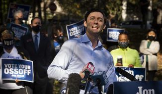 Georgia Democratic candidate for U.S. Senate Jon Ossoff speaks to the media as he rallies supporters for a run-off against Republican candidate Sen. David Perdue, as they meet in Grant Park, Friday, Nov. 6, 2020, in Atlanta. (AP Photo/John Amis)