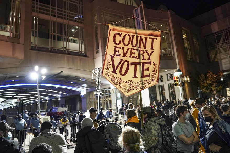 Demonstrators demanding for officials to &quot;COUNT EVERY VOTE&quot; rally outside the Pennsylvania Convention Center where votes are being counted, Thursday, Nov. 5, 2020, in Philadelphia. (AP Photo/John Minchillo)