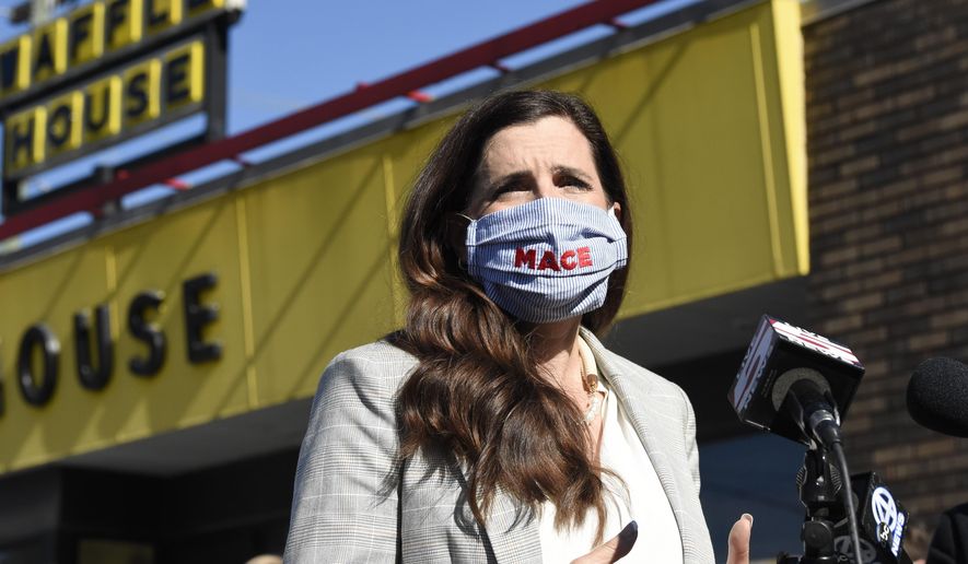 U.S. House candidate Nancy Mace addresses supporters outside a Waffle House where the Republican once worked on Wednesday, Nov. 4, 2020, in Ladson, S.C. Mace defeated Democratic U.S. House Rep. Joe Cunningham in South Carolina&#39;s 1st District. (AP Photo/Meg Kinnard)