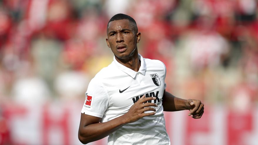 FILE - In this Sept 19, 2020 file photo, Augsburg's Felix Uduokhai plays during the German Bundesliga soccer match between 1. FC Union Berlin and FC Augsburg in Berlin, Germany. Germany coach Joachim Loew has called up two debutants for his team’s upcoming friendly against the Czech Republic and Nations League games against Ukraine and Spain. Loew named PSV Eindhoven’s Philipp Max and Augsburg’s Felix Uduokhai, both defenders, in his 29-member squad Friday, when Thilo Kehrer (Paris Saint-Germain), Ilkay Gundogan (Manchester City) and Leroy Sane (Bayern Munich) also returned after missing the October internationals. (AP Photo/Michael Sohn, FILE)