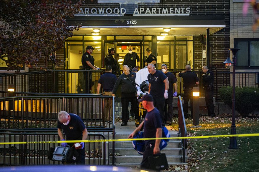 Toledo Police and first responders respond to the Parqwood Apartments, Thursday Nov. 5, 2020 in Toledo, Ohio. Police responded to reports of shots fired at the apartments Thursday. (Rebecca Benson/The Blade via AP)