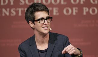 FILE - In this Oct. 16, 2017 file photo, MSNBC television anchor Rachel Maddow, host of &amp;quot;The Rachel Maddow Show,&amp;quot; moderates a panel at a forum called &amp;quot;Perspectives on National Security,&amp;quot; at the John F. Kennedy School of Government, at Harvard University, in Cambridge, Mass. MSNBC&#39;s Rachel Maddow said Friday, Nov. 6, 2020 she is quarantining after being in contact with someone who tested positive for the coronavirus. Maddow said on social media that she tested negative so far for COVID-19 but plans to remain at home until it&#39;s “safe for me to be back at work without putting anyone at risk.” (AP Photo/Steven Senne, File)