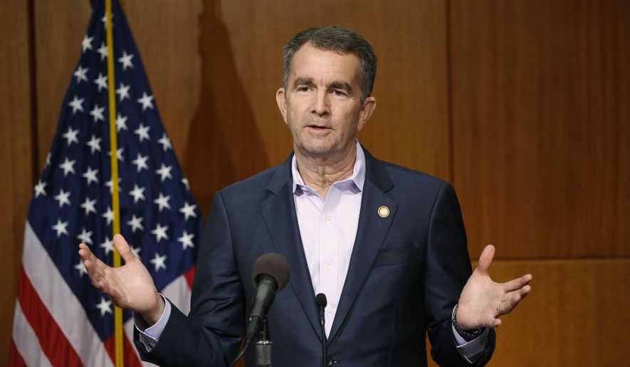 FILE - In this April 8, 2020, file photo, Virginia Gov. Ralph Northam gestures during a news conference at the Capitol in Richmond, Va. Northam has signed two criminal justice reform bills into law and proposed adding $1 million to the state budget to investigate the culture at the Virginia Military Institute after a newspaper article described allegations of racism. The legislature is scheduled to reconvene Monday, Nov. 9, to consider Northam’s proposed budget revisions and other amendments to legislation approved during a special session. (AP Photo/Steve Helber, File)