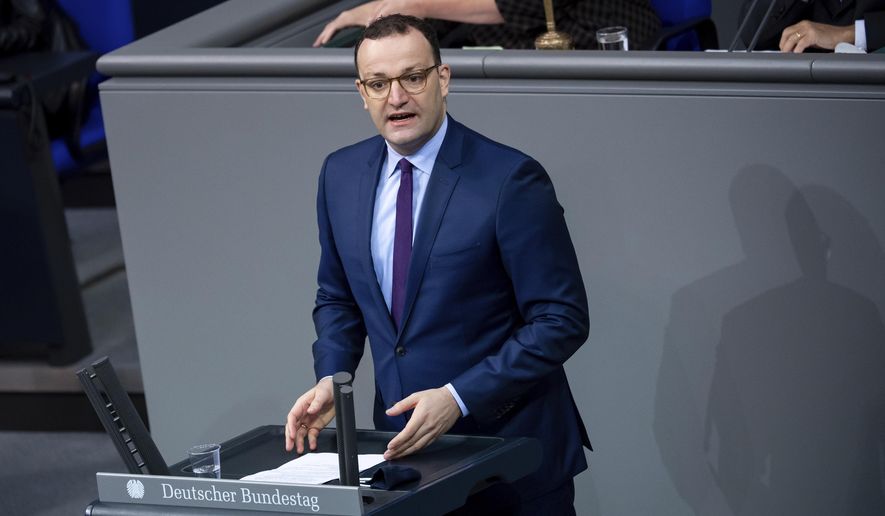 Jens Spahn, Federal Minister of Health, speaks in the plenary session of the German Bundestag in Berlin, Germany, Friday, Nov. 6, 2020. The main topics of the 190th session of the 19th legislative period are various debates on measures to be taken in the wake of the Corona pandemic, jobs in the automotive industry, the global situation of religious freedom, and the situation of the older generation. (Bernd von Jutrczenka/dpa via AP)