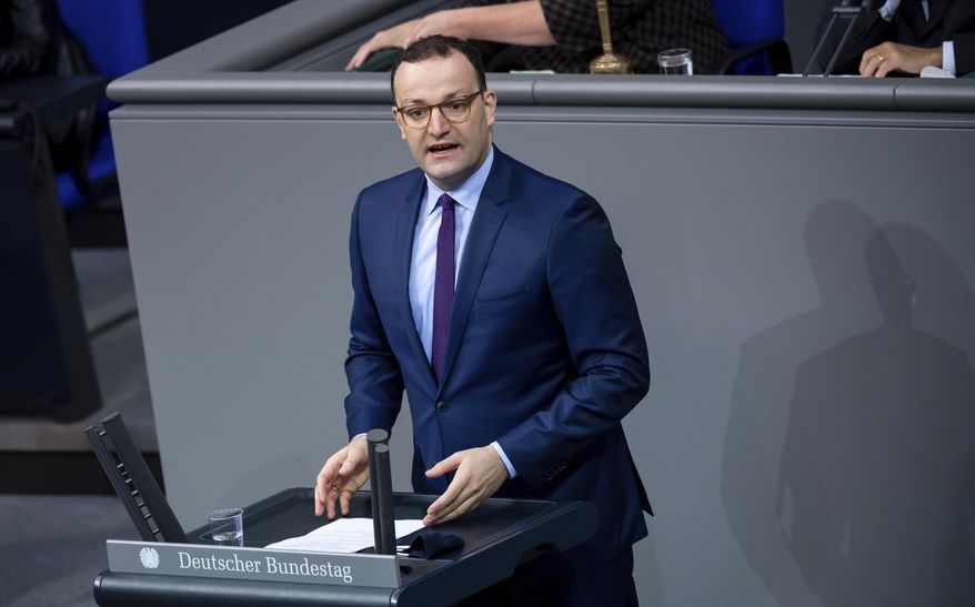 Jens Spahn, Federal Minister of Health, speaks in the plenary session of the German Bundestag in Berlin, Germany, Friday, Nov. 6, 2020. The main topics of the 190th session of the 19th legislative period are various debates on measures to be taken in the wake of the Corona pandemic, jobs in the automotive industry, the global situation of religious freedom, and the situation of the older generation. (Bernd von Jutrczenka/dpa via AP)