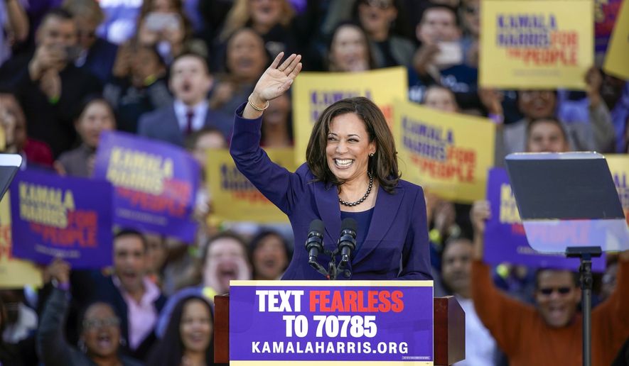 In this Jan. 27, 2019, file photo, Democratic Sen. Kamala Harris, of California, waves to the crowd as she formally launches her presidential campaign at a rally in her hometown of Oakland, Calif. Harris made history Saturday, Nov. 7,  as the first Black woman elected as vice president of the United States, shattering barriers that have kept men — almost all of them white — entrenched at the highest levels of American politics for more than two centuries. (AP Photo/Tony Avelar, File)