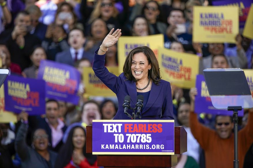 In this Jan. 27, 2019, file photo, Democratic Sen. Kamala Harris, of California, waves to the crowd as she formally launches her presidential campaign at a rally in her hometown of Oakland, Calif. Harris made history Saturday, Nov. 7,  as the first Black woman elected as vice president of the United States, shattering barriers that have kept men — almost all of them white — entrenched at the highest levels of American politics for more than two centuries. (AP Photo/Tony Avelar, File)