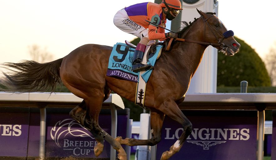 John Velazquez (9) rides Authentic to win the Breeder's Cup Classic horse race at Keeneland Race Course, in Lexington, Ky., Saturday, Nov. 7, 2020. (AP Photo/Michael Conroy)