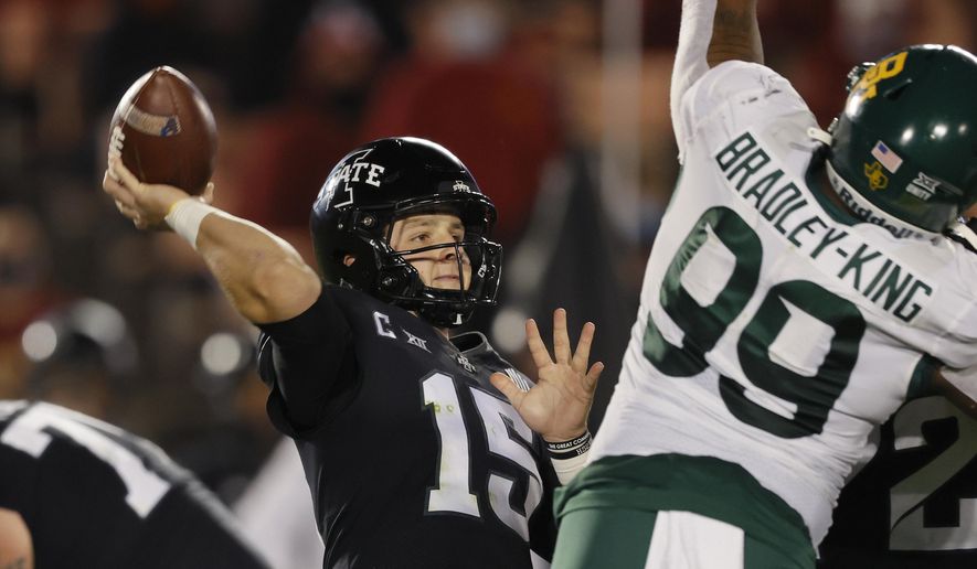 Iowa State quarterback Brock Purdy gets off a pass despite pressure from Baylor linebacker William Bradley-King during the first half of an NCAA college football game Saturday, Nov. 7, 2020, in Ames, Iowa. (AP Photo/Matthew Putney)