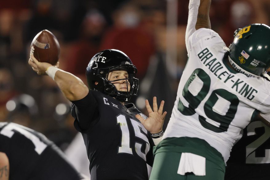 Iowa State quarterback Brock Purdy gets off a pass despite pressure from Baylor linebacker William Bradley-King during the first half of an NCAA college football game Saturday, Nov. 7, 2020, in Ames, Iowa. (AP Photo/Matthew Putney)