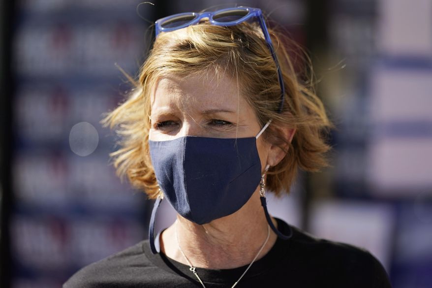 Rep. Susie Lee, D-Nev., meets with supporters at a canvass launch event on Election Day, Tuesday, Nov. 3, 2020, in Las Vegas. Lee is running against Dan Rodimer in Nevada's 3rd Congressional District.(AP Photo/John Locher)