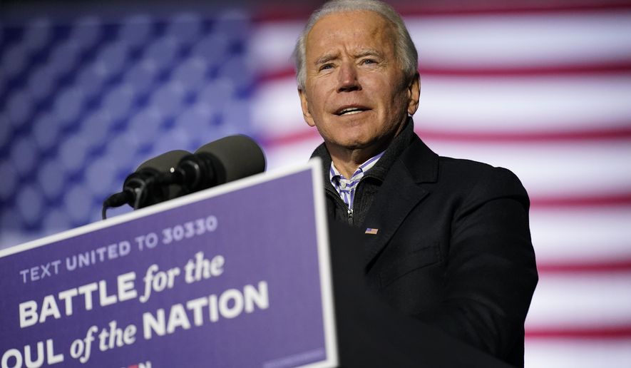FILE - In this Nov. 2, 2020, file photo Democratic presidential candidate former Vice President Joe Biden speaks during a drive-in rally at Heinz Field in Pittsburgh. (AP Photo/Andrew Harnik, File)