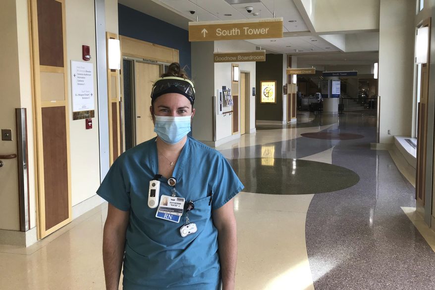 In this Oct. 27, 2020, photo, is Katie Janus, the charge nurse of the COVID floor at Benefis Health System in Great Falls, Mont. &amp;quot;It&#39;s basically indescribable until you are in it,&amp;quot; she said of working there. She says she tries to lead by example and remain positive even though she&#39;s seen more death in the past three months than she has seen in her two-year nursing career. She says the COVID deaths have some nurses wondering how long they can continue in their career. Janus says she helps them get through it by focusing on the patients who are able to recover and go home. (Karl Puckett/The Great Falls Tribune via AP)