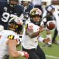 Maryland quarterback Taulia Tagovailoa (3) pitches the ball to Maryland running back Jake Funk (34) against Penn State in the first quarter of an NCAA college football game in State College, Pa., Saturday, Nov. 7, 2020. (AP Photo/Barry Reeger)