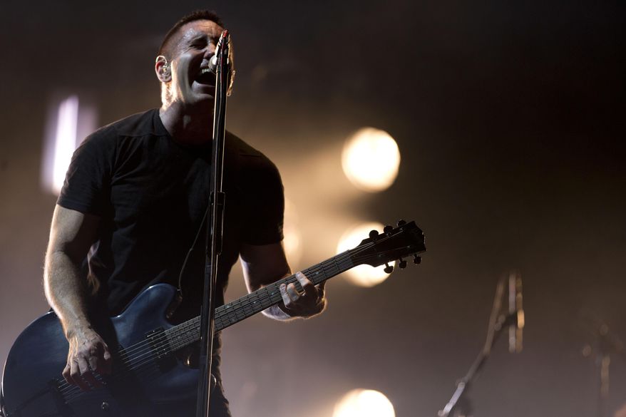 In this March 27, 2014 file photo, Trent Reznor of Nine Inch Nails performs at the Vive Latino music festival in Mexico City, Mexico. (AP Photo/Rebecca Blackwell, File)