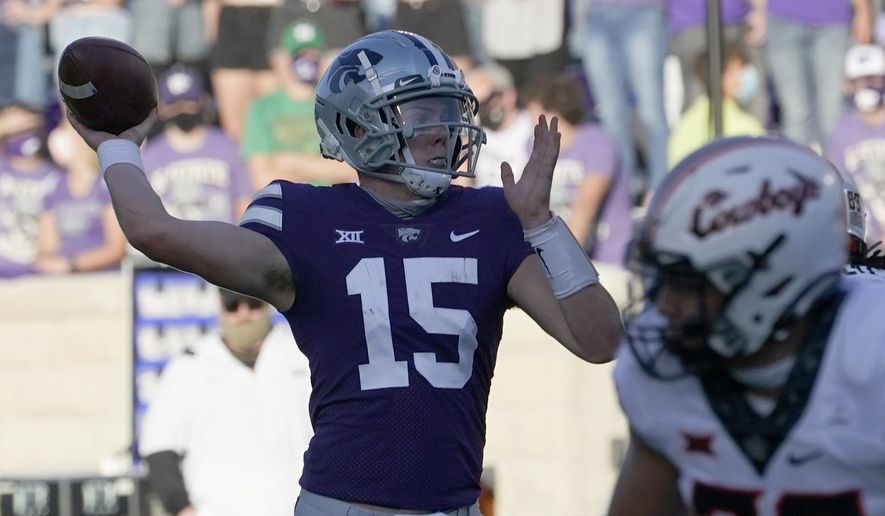 Kansas State quarterback Will Howard (15) passes to a teammate during the first half of an NCAA college football game against Oklahoma State in Manhattan, Kan., Saturday, Nov. 7, 2020. (AP Photo/Orlin Wagner)