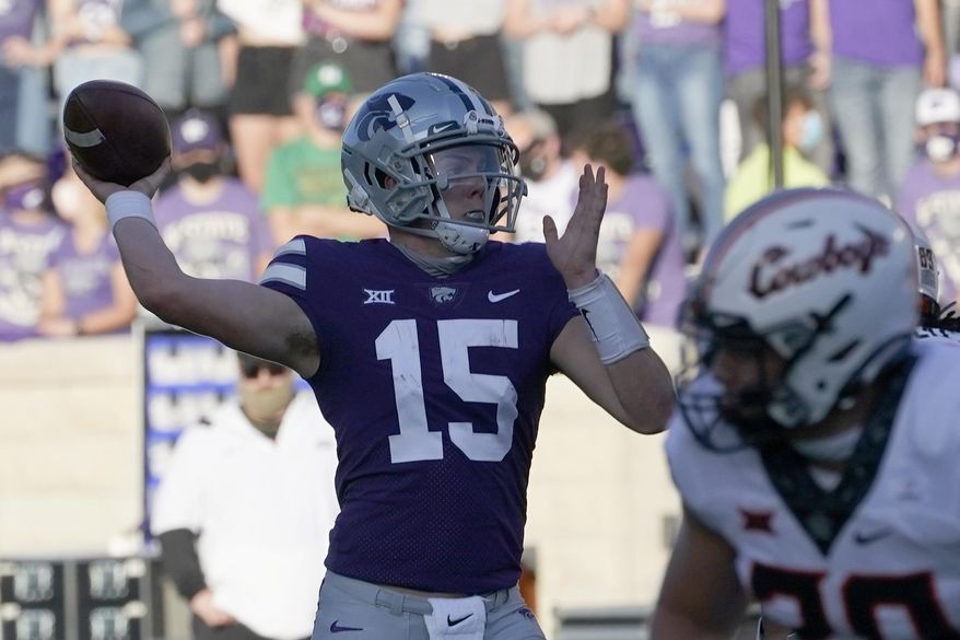 Kansas State quarterback Will Howard (15) passes to a teammate during the first half of an NCAA college football game against Oklahoma State in Manhattan, Kan., Saturday, Nov. 7, 2020. (AP Photo/Orlin Wagner)