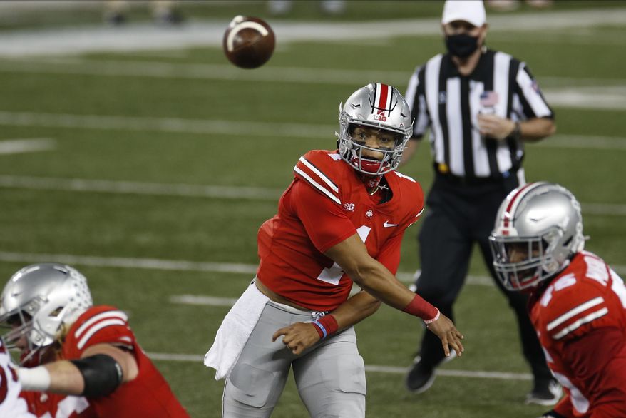 Ohio State quarterback Justin Fields throws a pass against Rutgers during the first half of an NCAA college football game Saturday, Nov. 7, 2020, in Columbus, Ohio. (AP Photo/Jay LaPrete)