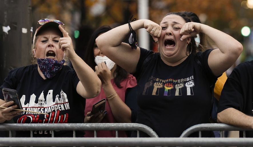 Supporters of President-elect Joe Biden taunt supporters of President Donald Trump as they protest outside the Pennsylvania Convention Center in Philadelphia, Sunday, Nov. 8, 2020, a day after the 2020 election was called for Democrat Joe Biden.(AP Photo/Rebecca Blackwell)