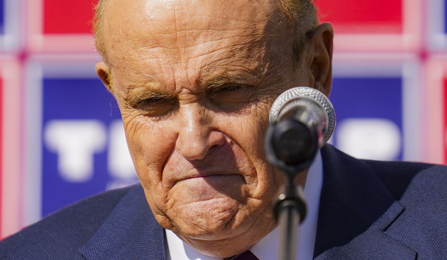 Former New York mayor Rudy Giuliani, a lawyer for President Donald Trump, pauses as he speaks during a news conference on legal challenges to vote counting in Pennsylvania, Saturday Nov. 7, 2020, in Philadelphia.