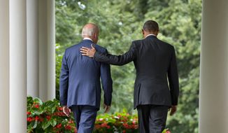 President Barack Obama walks with Vice President Joe Biden back to the Oval Office of the White House in Washington, Thursday, June 25, 2015, after speaking in the Rose Garden. (AP Photo/Pablo Martinez Monsivais)