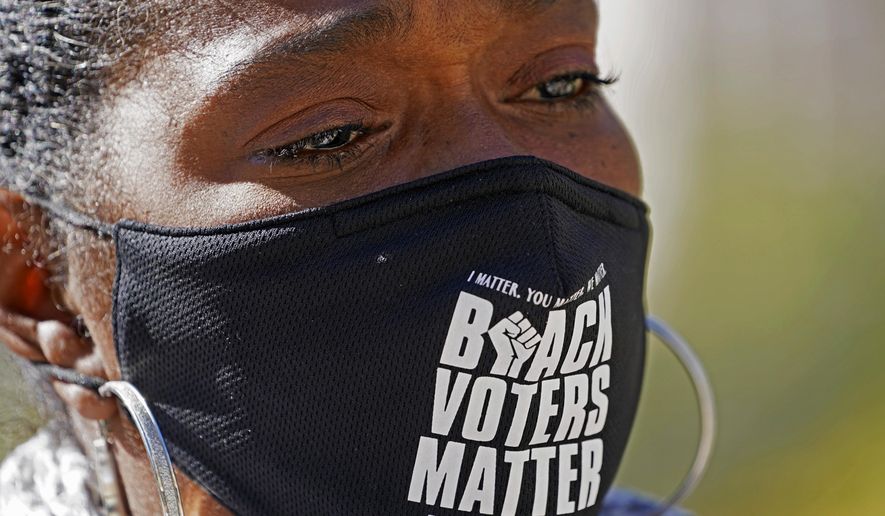 FILE - In this Nov. 2, 2020, file photo, Sharon Brown, co-chair of the Mississippi Poor Peoples Campaign, reacts during a news conference at the state Capitol in Jackson, Miss., over voting concerns statewide. Months of discussions about racial justice are being followed by change at the ballot box. (AP Photo/Rogelio V. Solis, File)