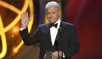 Alex Trebek gestures while presenting an award at the 46th annual Daytime Emmy Awards in Pasadena, Calif. (Photo by Chris Pizzello/Invision/AP, File)