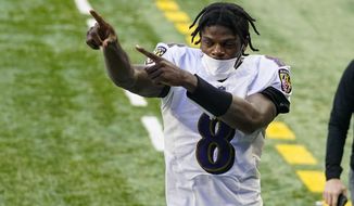 Baltimore Ravens quarterback Lamar Jackson (8) acknowledges fans as he leaves the field following an NFL football game against the Indianapolis Colts in Indianapolis, Sunday, Nov. 8, 2020. The Ravens defeated the Colts 24-10. (AP Photo/Darron Cummings)
